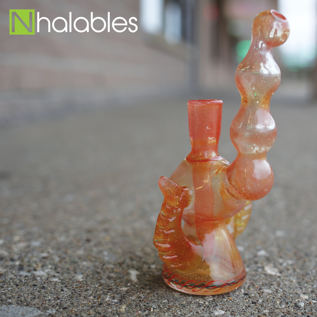 Nhalables Social Post for a Giveaway showing a Tangerine Oil Rig by Grover Glass sitting on the asphalt in front of a brick building.