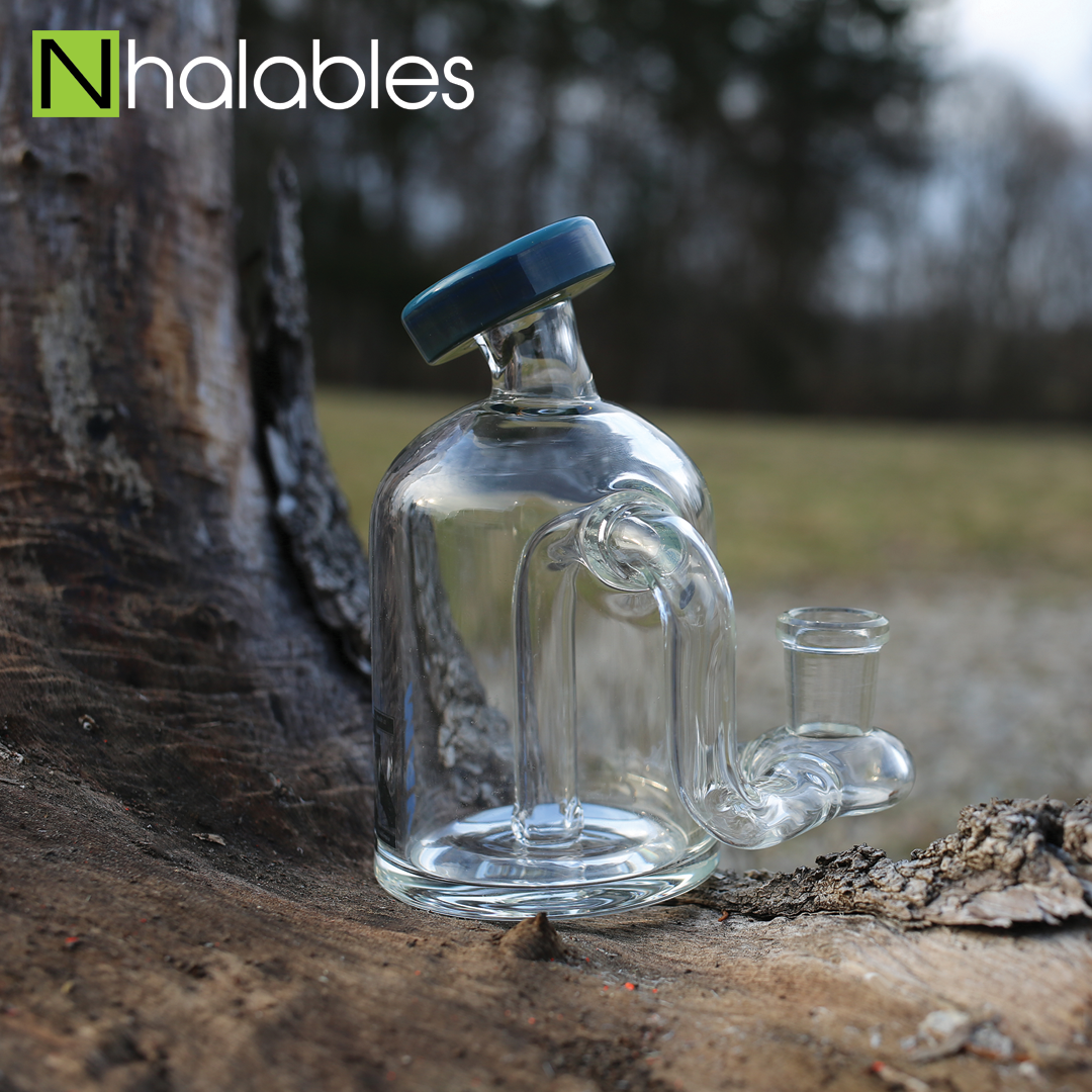 Nhalables Social Post showing a Mav Glass (California) CC Rig Sitting on a wooden stump with a tree in the background.