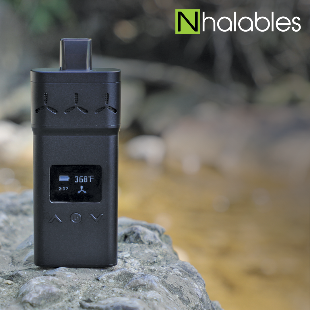 Nhalables Social Image for Airvape X Dry Herb Vaporizer sitting on a rock with water behind it