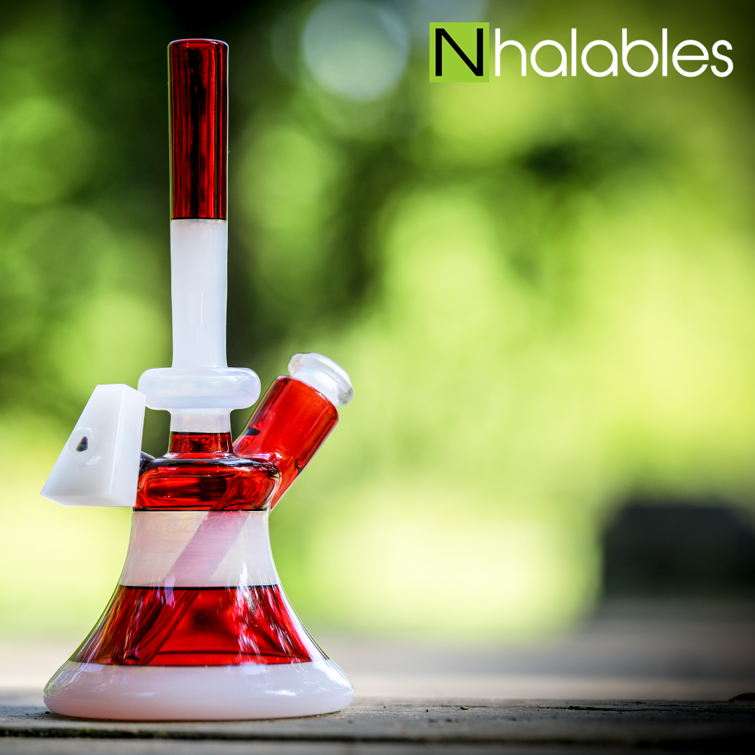 Nhalables Social Post showing a Gluestick and Pomegranate Full Color Seer by Andy Roth Glass (@andyrothglass) sitting on some wood with trees in the background