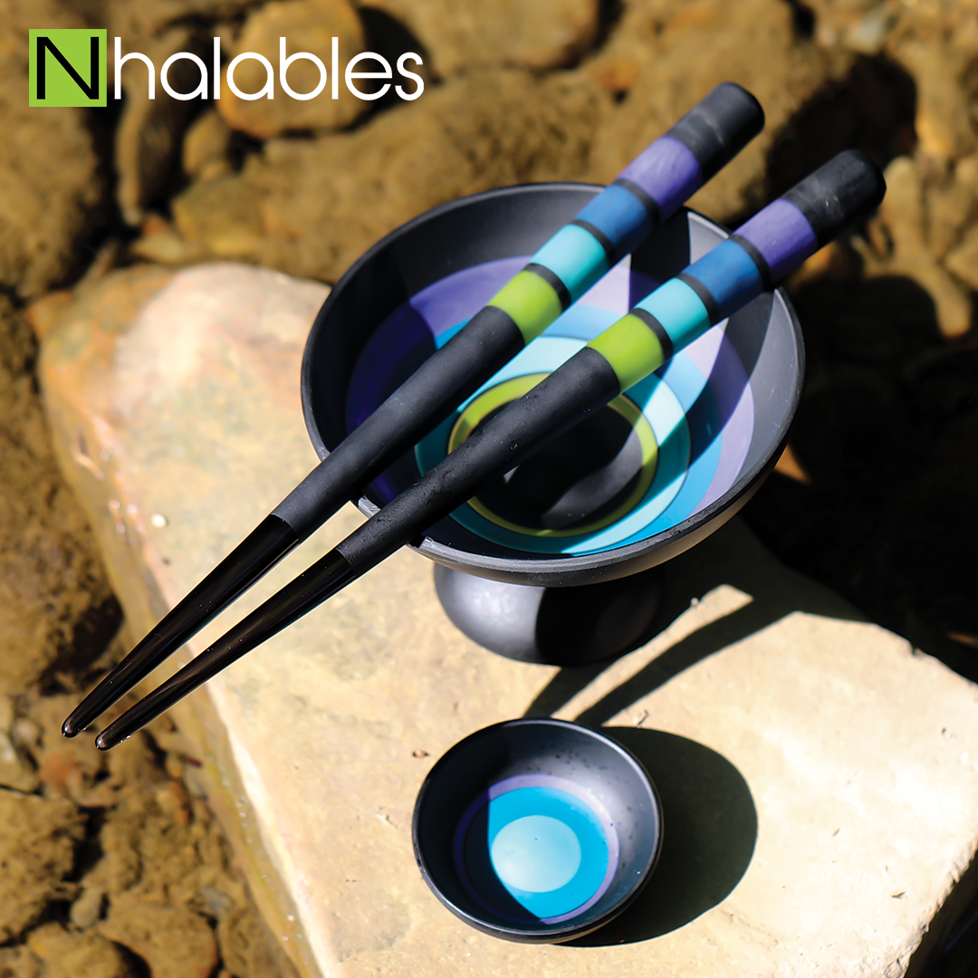 Nhalables Social Post showing a Emily Marie Chopstick Set sitting on a rock in a river bed