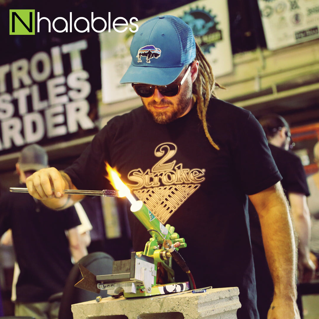 Nhalables Social Post Showing Glass Blower Brandon Martin Doing HIs Glass Demo at The Michigan Glass Project 2016 in Detroit Michigan